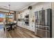 Modern kitchen boasts stainless steel appliances, white cabinetry, and plenty of counter space at 22036 N 44Th Pl, Phoenix, AZ 85050