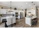 Bright kitchen features stainless steel appliances, a tile backsplash, and a dining area with modern light fixture at 22036 N 44Th Pl, Phoenix, AZ 85050