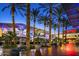 Outdoor shopping mall featuring palm trees covered in lights, with outdoor seating at 22036 N 44Th Pl, Phoenix, AZ 85050