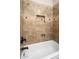 Detailed view of the tiled shower with design accents and a convenient shower niche at 22036 N 44Th Pl, Phoenix, AZ 85050