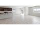Bright kitchen and open living space featuring granite countertops and tile flooring at 25224 W Chanute Pass, Buckeye, AZ 85326