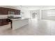 Modern kitchen featuring stainless steel appliances, granite countertops, and adjacent dining area at 25224 W Chanute Pass, Buckeye, AZ 85326