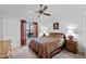 Comfortable bedroom with a ceiling fan, neutral decor, and natural light streaming through the window at 2736 Leisure World --, Mesa, AZ 85206