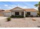 Charming single-story home featuring a well-maintained desert landscaped front yard and a red tile roof at 2736 Leisure World --, Mesa, AZ 85206