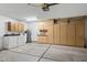 Spacious garage featuring laundry, lots of storage cabinets, utility sink and room for car parking at 2736 Leisure World --, Mesa, AZ 85206