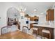 Bright kitchen with wooden cabinetry, white countertops, and seamless flow into living spaces at 2736 Leisure World --, Mesa, AZ 85206
