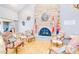 Cozy lounge area with a stone fireplace, comfortable chairs, and patriotic decor at 2736 Leisure World --, Mesa, AZ 85206