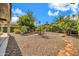 Desert landscaped backyard with a rock garden and decorative stone pathway at 27614 N 129Th Ln, Peoria, AZ 85383