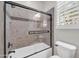 Bathroom with a tiled shower, glass door, and modern fixtures, creating a clean and functional space at 27614 N 129Th Ln, Peoria, AZ 85383