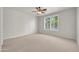 Spacious bedroom with neutral carpet, plantation shutters, and ample natural light at 27614 N 129Th Ln, Peoria, AZ 85383