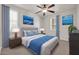 Comfortable bedroom with neutral walls, a ceiling fan, and stylish decor for a tranquil retreat at 27614 N 129Th Ln, Peoria, AZ 85383