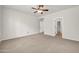Expansive bedroom with neutral walls, carpet, and access to the ensuite bathroom at 27614 N 129Th Ln, Peoria, AZ 85383