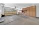 Large garage featuring built-in storage and ample space for vehicles, projects, and organizational needs at 27614 N 129Th Ln, Peoria, AZ 85383