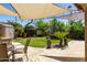 A well-kept backyard with a trampoline, storage shed, and seating area at 29431 N 23Rd Dr Dr, Phoenix, AZ 85085
