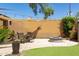 A cozy backyard with a fire pit, seating, and lush landscaping at 29431 N 23Rd Dr Dr, Phoenix, AZ 85085