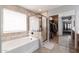 Bathroom with a soaking tub, stand-up shower, and walk-in closet at 29431 N 23Rd Dr Dr, Phoenix, AZ 85085