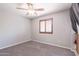 Neutral carpet, ceiling fan and bright natural light add appeal to this lovely bedroom at 29431 N 23Rd Dr Dr, Phoenix, AZ 85085