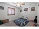 Cozy bedroom features neutral carpet, ceiling fan, and bright natural light at 29431 N 23Rd Dr Dr, Phoenix, AZ 85085