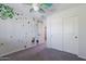 Bedroom with wall decals and a sliding-door closet at 29431 N 23Rd Dr Dr, Phoenix, AZ 85085