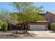 Inviting exterior of home, featuring a two-car garage, desert landscaping, and a tile roof at 29431 N 23Rd Dr Dr, Phoenix, AZ 85085