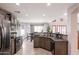 Bright kitchen featuring stainless steel appliances, granite countertops, and ample cabinet space at 29431 N 23Rd Dr Dr, Phoenix, AZ 85085