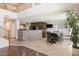 Bright, open-concept kitchen and dining area with stone island and modern appliances at 29431 N 23Rd Dr Dr, Phoenix, AZ 85085