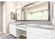Primary bathroom with double vanity, spacious countertops and white cabinetry at 3023 E Arabian Dr, Gilbert, AZ 85296