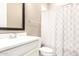 Clean bathroom featuring a vanity with mirror and a shower with patterned curtain at 3023 E Arabian Dr, Gilbert, AZ 85296