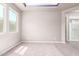 Bright neutral bedroom with carpet flooring, large windows, and access to the bathroom at 3023 E Arabian Dr, Gilbert, AZ 85296