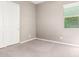 Cozy bedroom with neutral carpet, paint, and a window for natural light at 3023 E Arabian Dr, Gilbert, AZ 85296