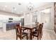 Open concept dining room with views of the kitchen and living spaces, wood-look flooring at 3023 E Arabian Dr, Gilbert, AZ 85296