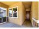 Inviting entryway featuring a solid wood front door, decorative stone accents, and a cozy, covered porch area at 3023 E Arabian Dr, Gilbert, AZ 85296