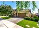 Beautiful single-Gathering home featuring a well-manicured lawn, brick driveway, and an attached two-car garage at 3023 E Arabian Dr, Gilbert, AZ 85296