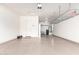 Clean garage interior with painted floor and water filtration system in the corner at 3023 E Arabian Dr, Gilbert, AZ 85296