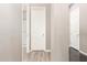 Hallway with tile floors and multiple doors offering access to various rooms at 3023 E Arabian Dr, Gilbert, AZ 85296