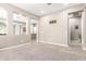 Spacious open floor plan featuring a pass through to a kitchen and multiple entryways to other rooms at 3023 E Arabian Dr, Gilbert, AZ 85296