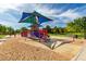 The playground with colorful equipment offers a safe and fun space for to play at 3023 E Arabian Dr, Gilbert, AZ 85296