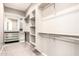 Walk-in closet featuring custom shelving and hanging racks at 3023 E Arabian Dr, Gilbert, AZ 85296