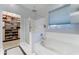 Bathroom featuring a modern bathtub, a glass-enclosed shower, and access to a walk-in closet at 3153 E Ivanhoe St, Gilbert, AZ 85295