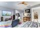 Well-decorated bedroom with a comfortable bed, TV, and organized storage solutions at 3153 E Ivanhoe St, Gilbert, AZ 85295