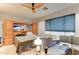 Cozy bedroom featuring a comfortable bed, built-in cabinet, and a relaxing seating area at 3153 E Ivanhoe St, Gilbert, AZ 85295