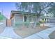 Charming front exterior featuring brick accents and lush landscaping, enhanced by a paver walkway at 3153 E Ivanhoe St, Gilbert, AZ 85295