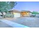 Charming single-story home with a two-car garage, brick accents, and a well-manicured front yard at 3153 E Ivanhoe St, Gilbert, AZ 85295
