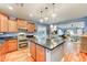 Spacious kitchen features stainless steel appliances, granite countertops, and a center island at 3153 E Ivanhoe St, Gilbert, AZ 85295
