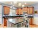 Modern kitchen featuring granite countertops, stainless steel appliances, and a large island with seating at 3153 E Ivanhoe St, Gilbert, AZ 85295