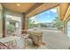 Inviting front porch with brick pillars and cozy seating, perfect for enjoying the neighborhood views at 3153 E Ivanhoe St, Gilbert, AZ 85295