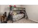bedroom with bunk beds, carpeted floor and toys at 317 W Tonopah Dr # 2, Phoenix, AZ 85027