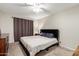 Relaxing bedroom with soft carpet, a dresser, and a large window with dark curtains at 317 W Tonopah Dr # 2, Phoenix, AZ 85027