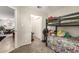 bedroom with bunk beds, carpeted floor and view to the dining room at 317 W Tonopah Dr # 2, Phoenix, AZ 85027
