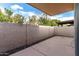 View of a private backyard patio with a textured wall, offering a secluded outdoor space at 3345 E University Dr # 73, Mesa, AZ 85213